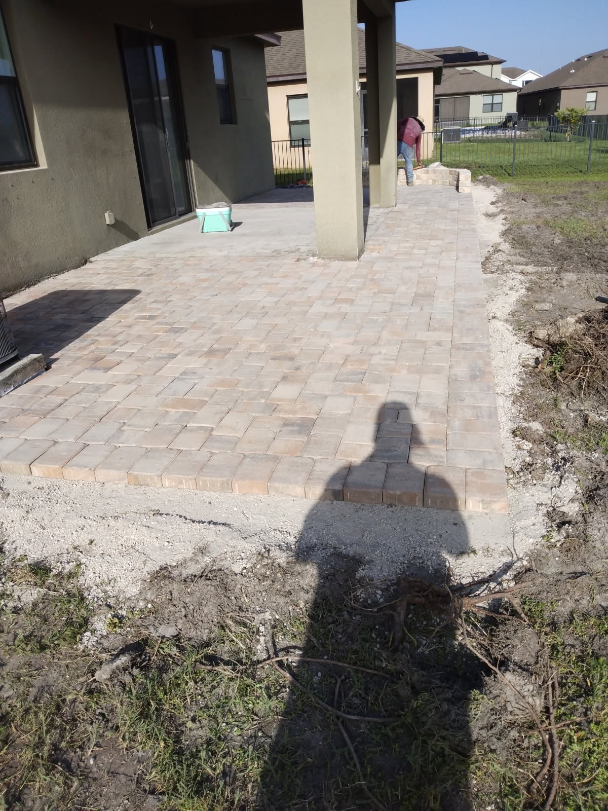 Completed paver patio beside the home