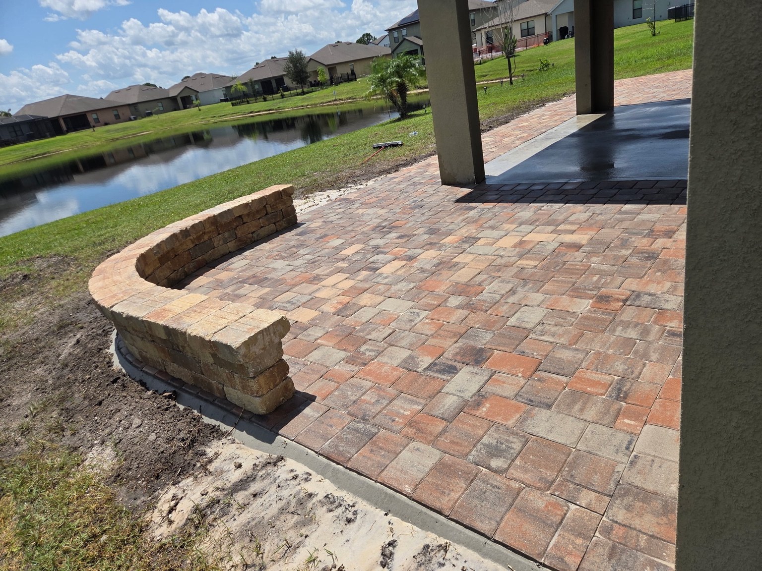 Finished multicolor paver patio and retaining wall