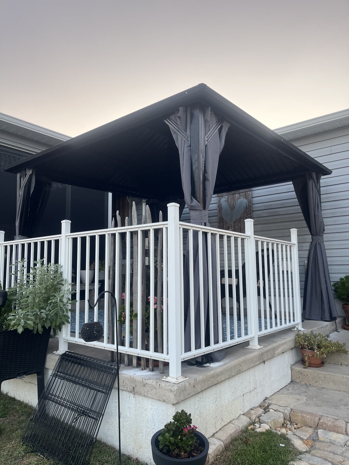 Covered patio with outdoor curtains and seating