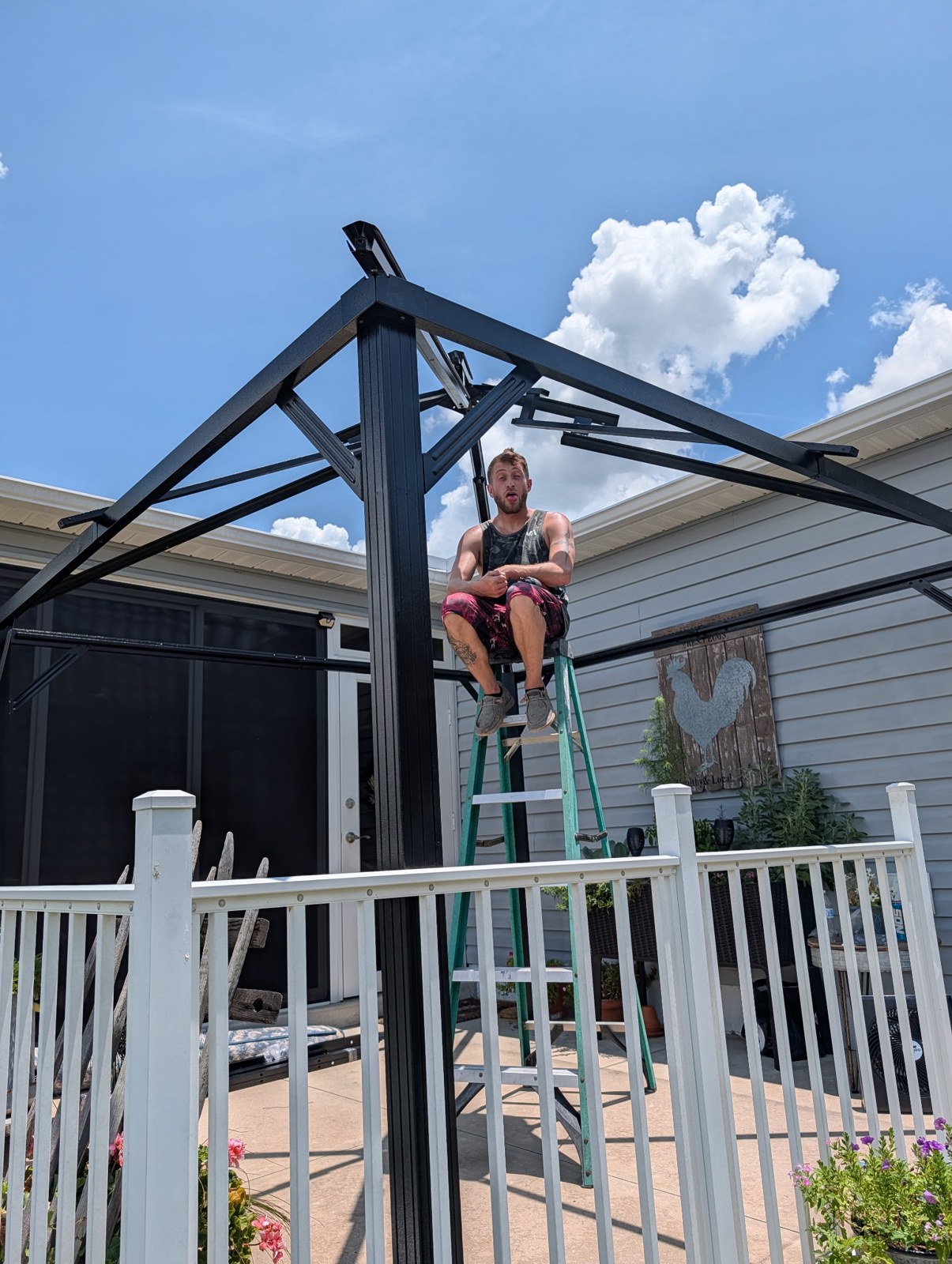 Black aluminum patio cover frame during installation