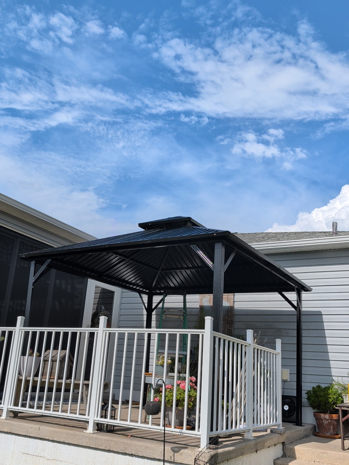 Completed black metal roof patio cover