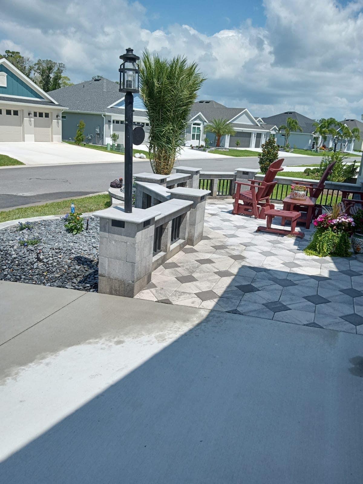 Concrete patio area being graded and formed beside the garage