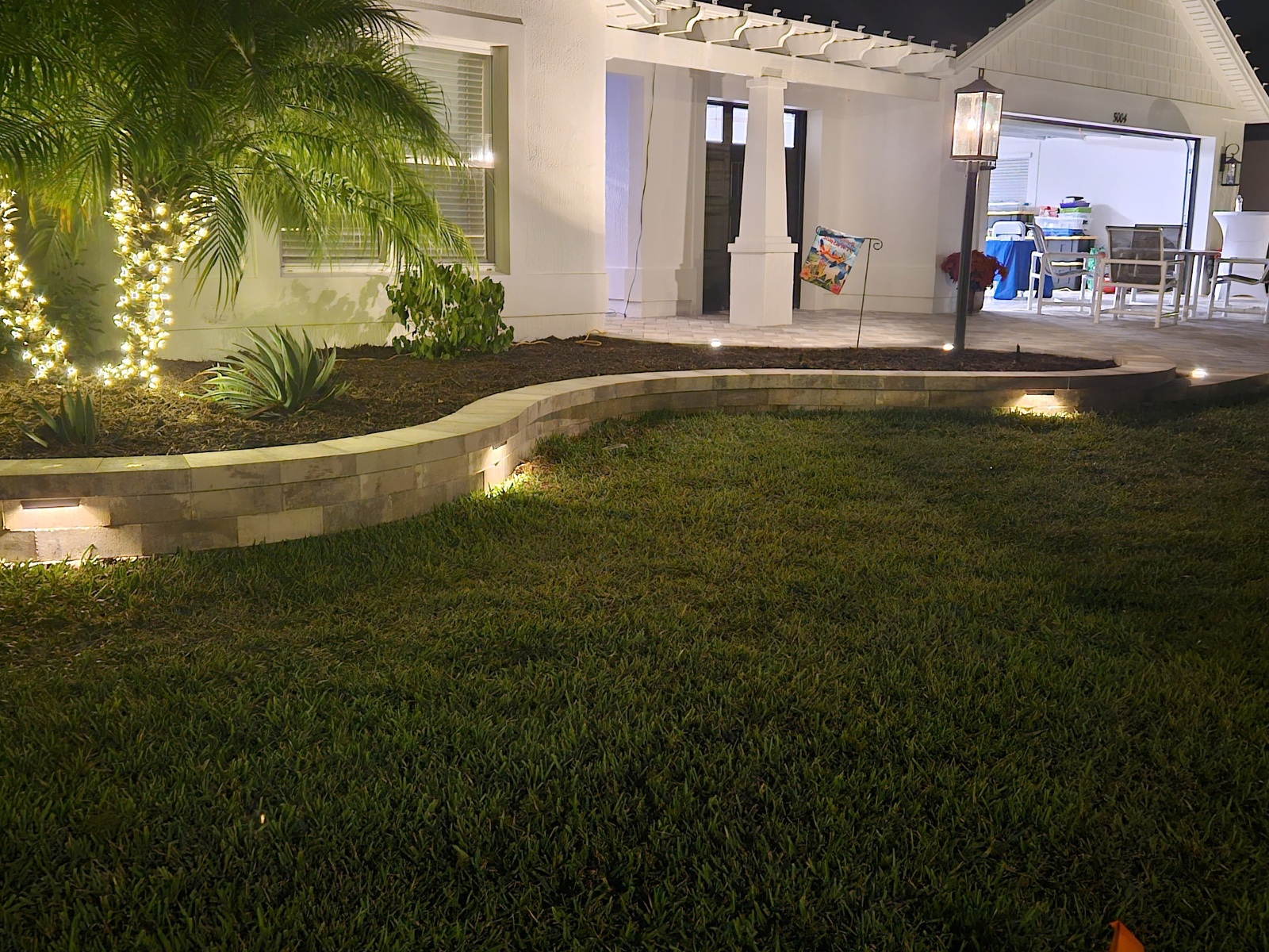 Paver walkway installation with compacted base and finished paver path