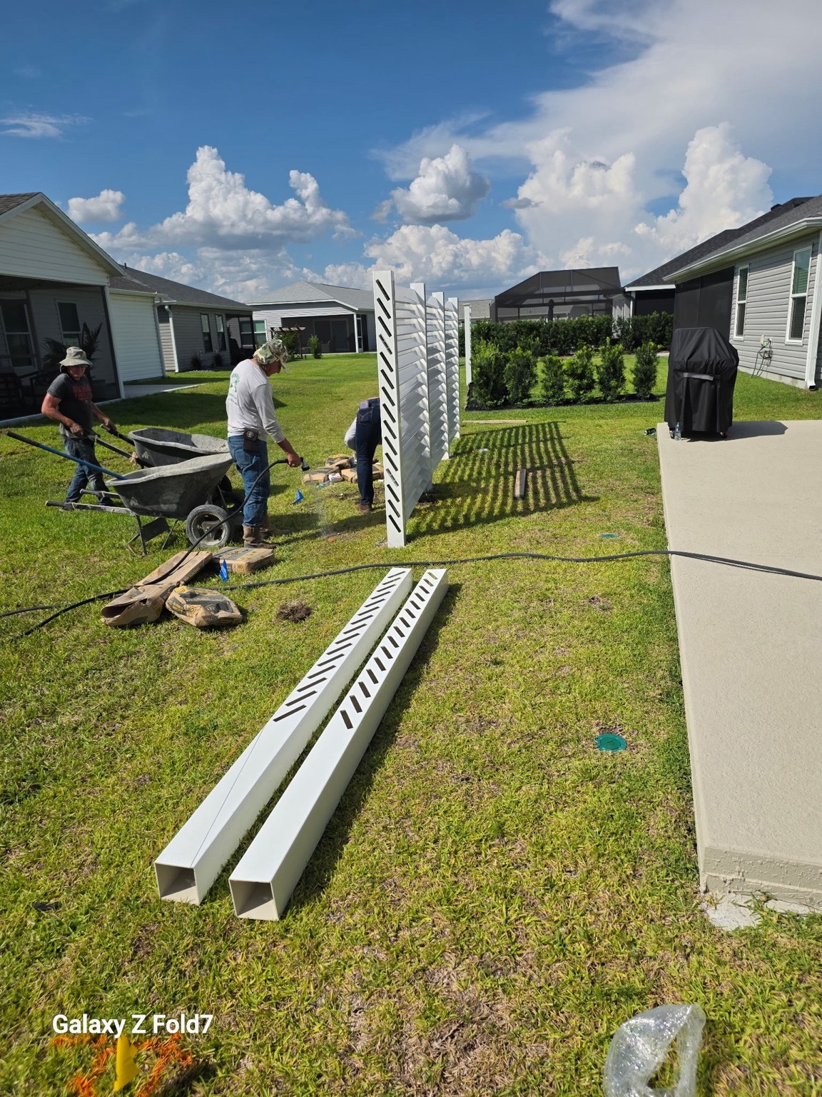 Completed white vinyl privacy fence